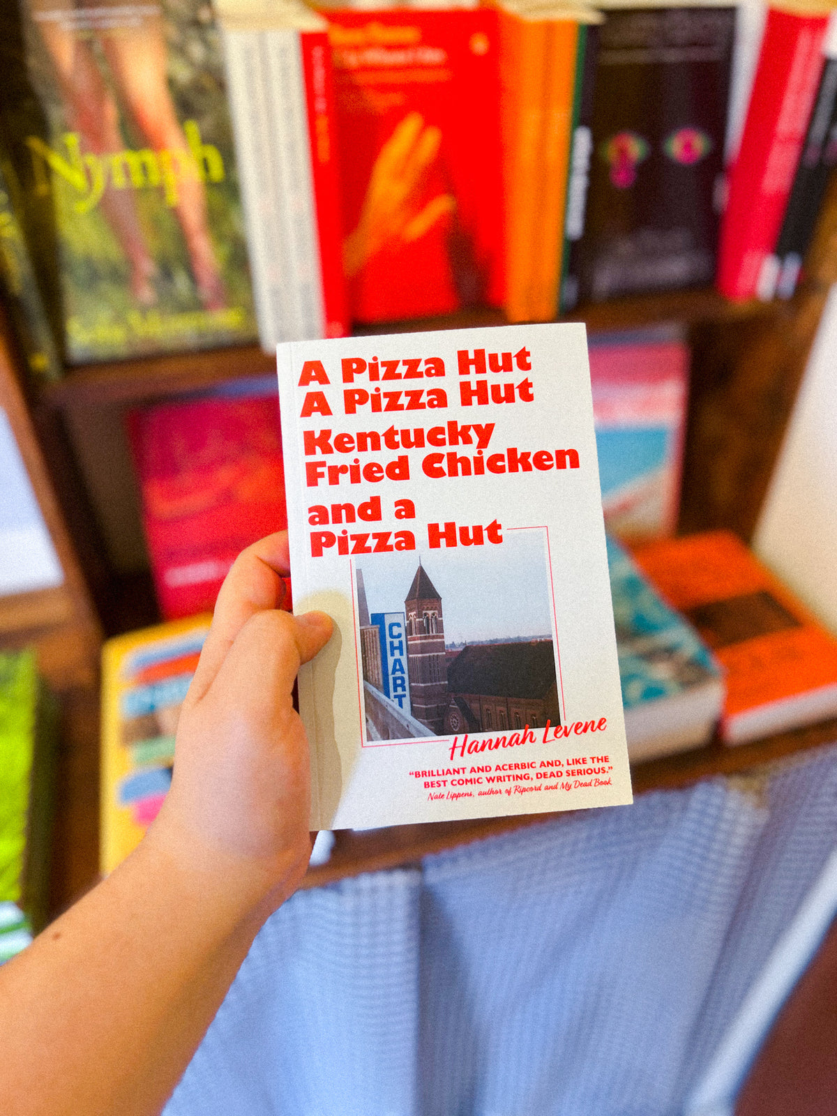 "A Pizza Hut, a Pizza Hut, Kentucky Fried Chicken and a Pizza Hut" by Hannah Levene